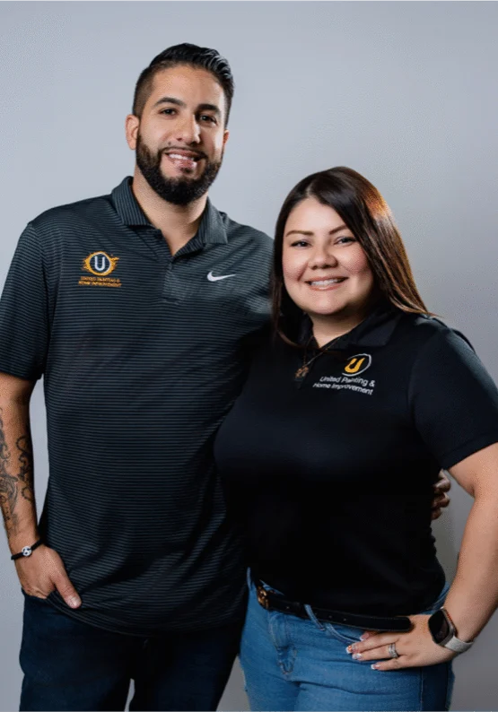 United Painting owners Angel Pastrana and Steffany in branded polo shirts